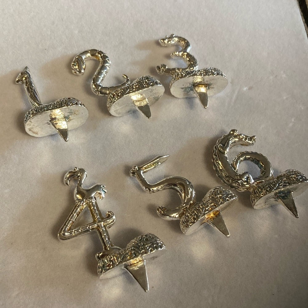Silver tone animal birthday markers holds candle in each one . 1-6 . Pre owned